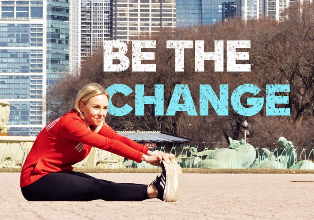Woman sitting on ground stretching with be The Change text overlay